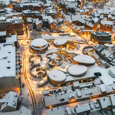 The old quarter with lights and snow